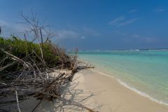 Walking along the beach at Soneva Jani resort