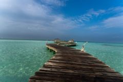 Soneva Jani Boardwalk Over Ocean Blue Sky